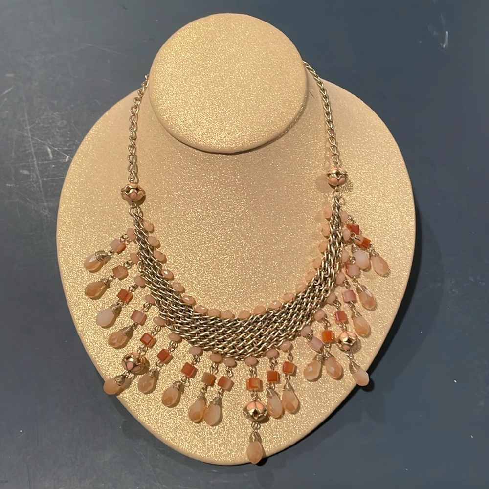 Statement necklace with blush color and gold chain